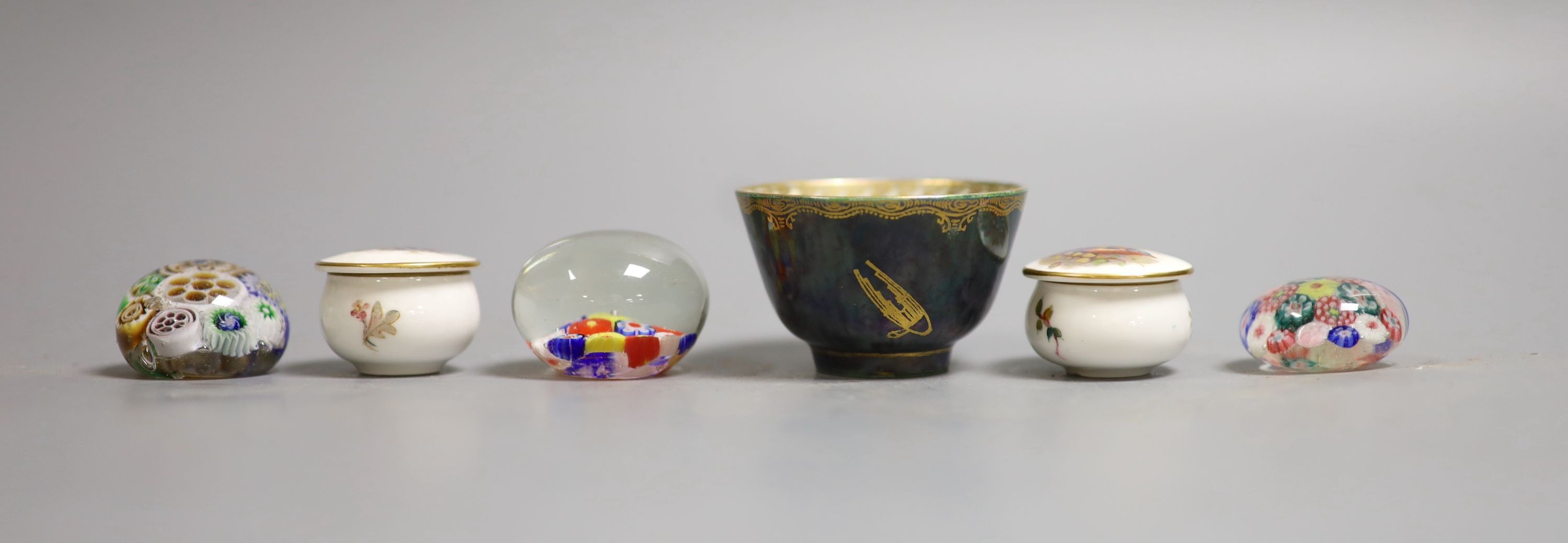 A Wedgwood lustre small cup, 4cm high, two Royal Worcester 'bird' pots & covers and three glass millefiori paperweights.